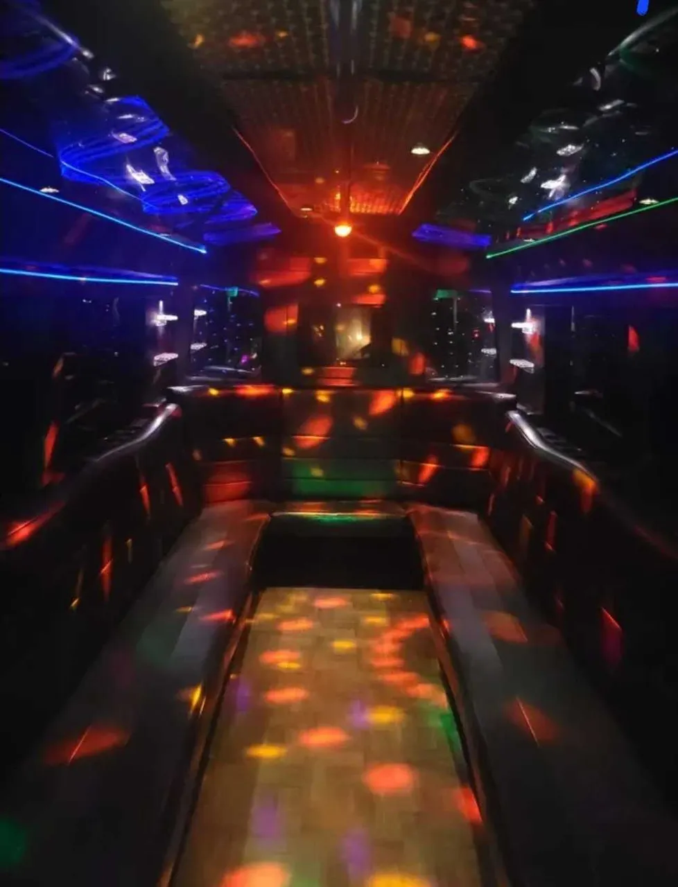 Black Party Bus interior with perimeter lounge seating and LED accent lighting, photo 2 for prom car rental in Schertz, TX Black Party Bus interior with perimeter lounge seating and LED accent lighting, photo 2 for prom car rental in Schertz, TX