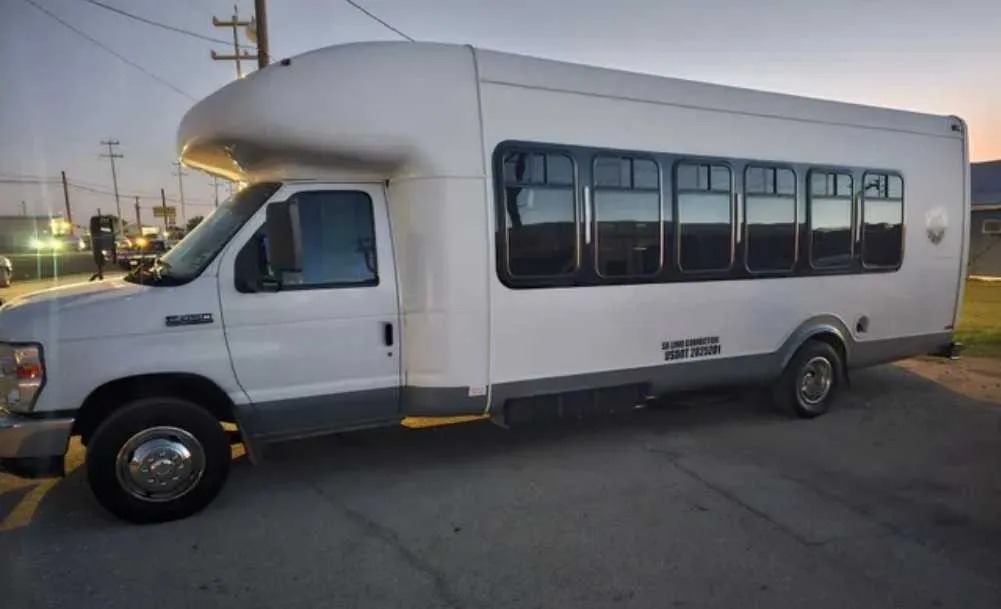 White D-Town Bus exterior for prom car rental in Schertz, TX White D-Town Bus exterior for prom car rental in Schertz, TX