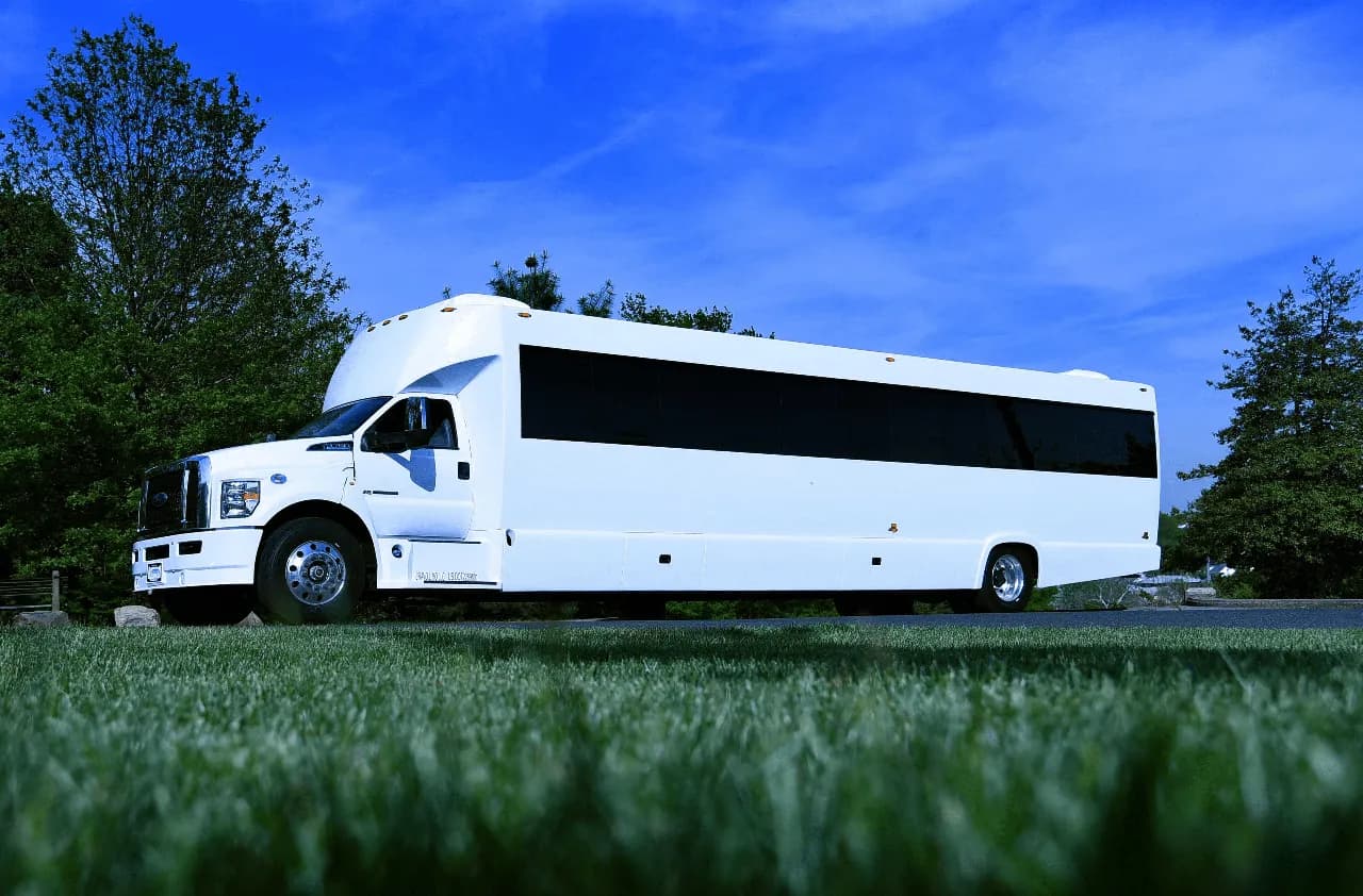 White 50 Passenger Party Bus exterior with tinted windows for party bus rental in West Orange, NJ White 50 Passenger Party Bus exterior with tinted windows for party bus rental in West Orange, NJ