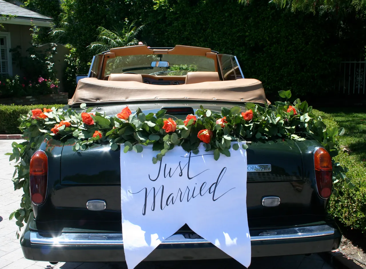 Green 1983 Rolls-Royce Corniche Convertible exterior with convertible roof, photo 7 for wedding car rental in Tarzana, CA
