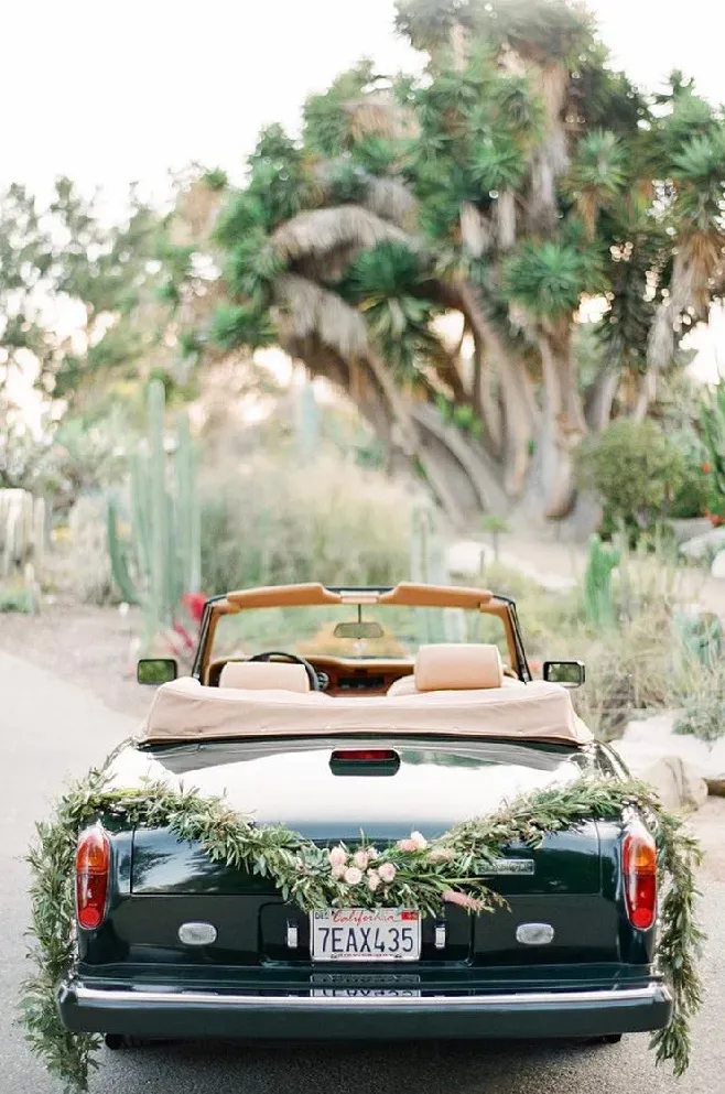 Green 1983 Rolls-Royce Corniche Convertible exterior with convertible roof, photo 10 for wedding car rental in Tarzana, CA