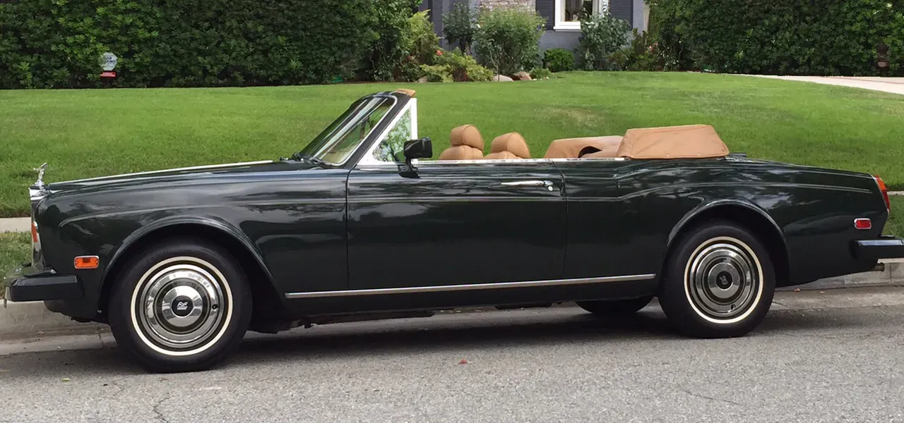 Green 1983 Rolls-Royce Corniche Convertible exterior with convertible roof, photo 11 for wedding car rental in Tarzana, CA