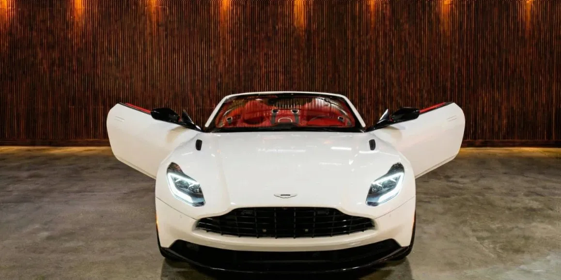 White Aston Martin DB11 with convertible roof for wedding car rental in Hempstead, NY