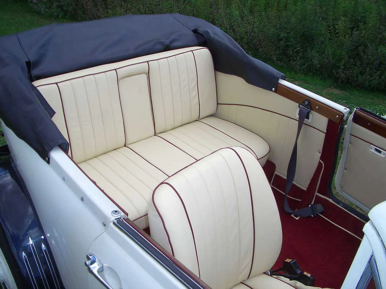 Beauford 1920 interior with convertible roof for wedding car rental in Dallas, TX