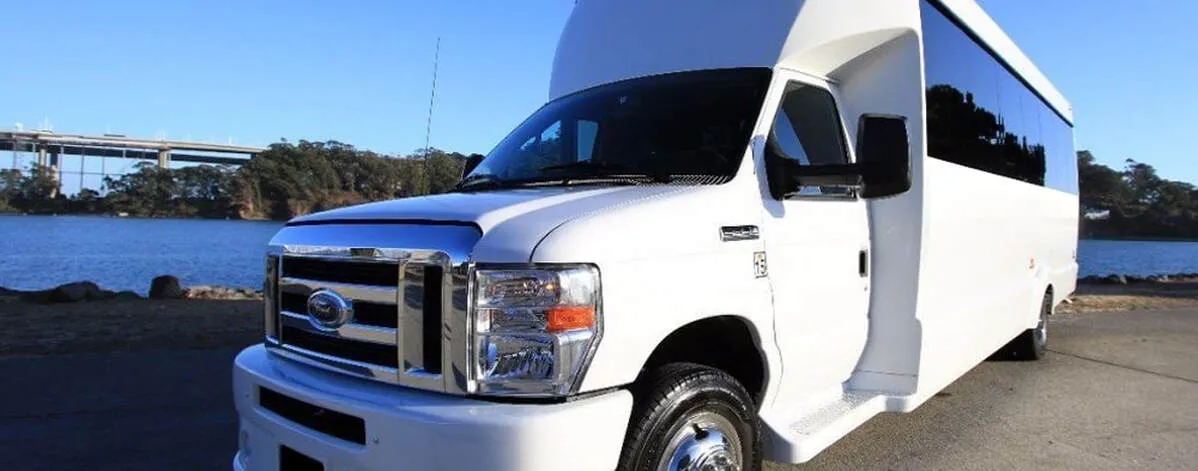 White Ford F-550 Party Bus exterior with tinted windows for limo rental in York, ME