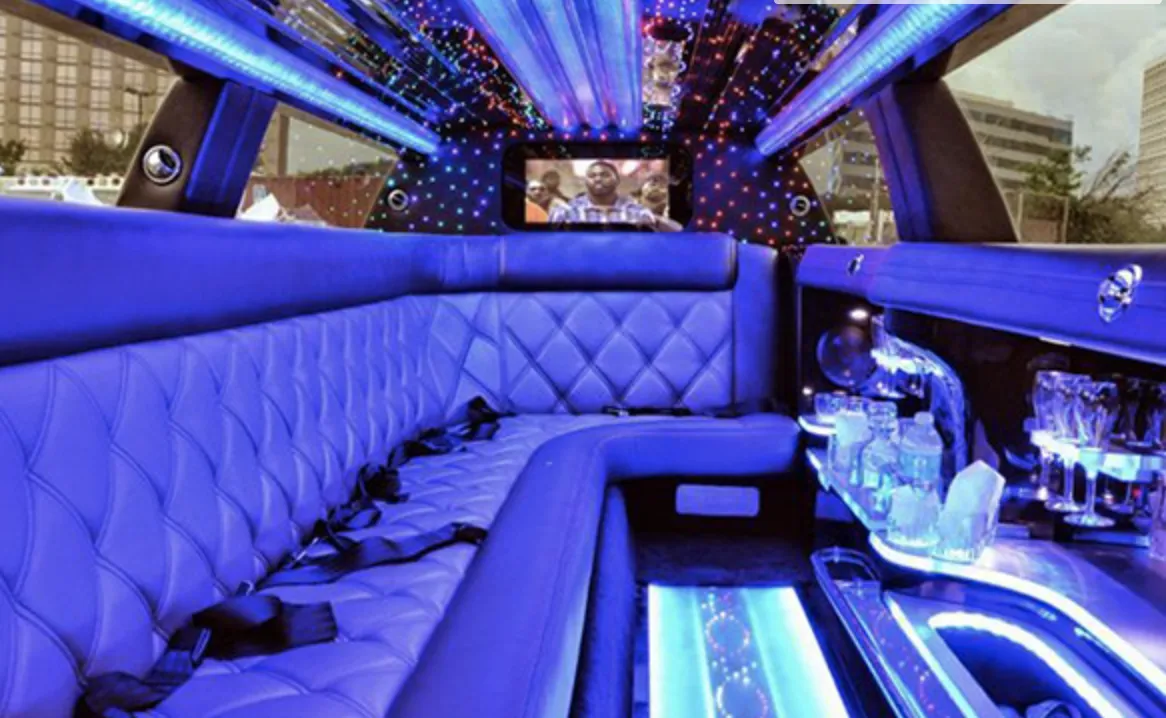 C300 Limousine interior with sofa-style seating, LED accent lighting and LED ceiling lighting for limo rental