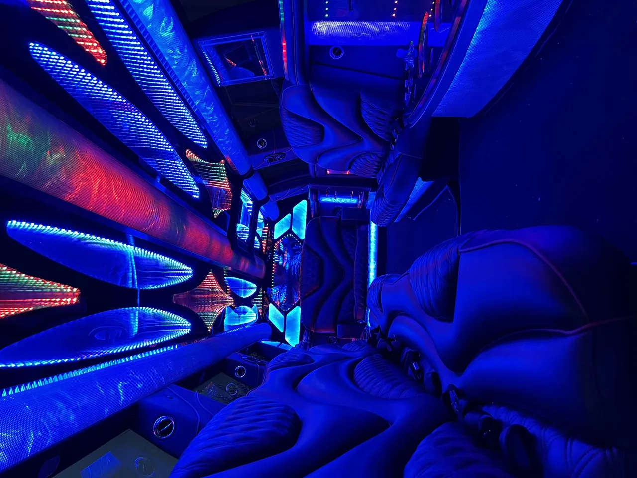 Cadillac Escalade Limousine interior with LED accent lighting and LED ceiling lighting for hummer limo rental in Farmington, CA