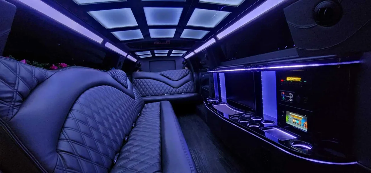 Chrysler 300 10 Passenger Limousine interior with LED accent lighting, LED ceiling lighting and bar area for limo rental