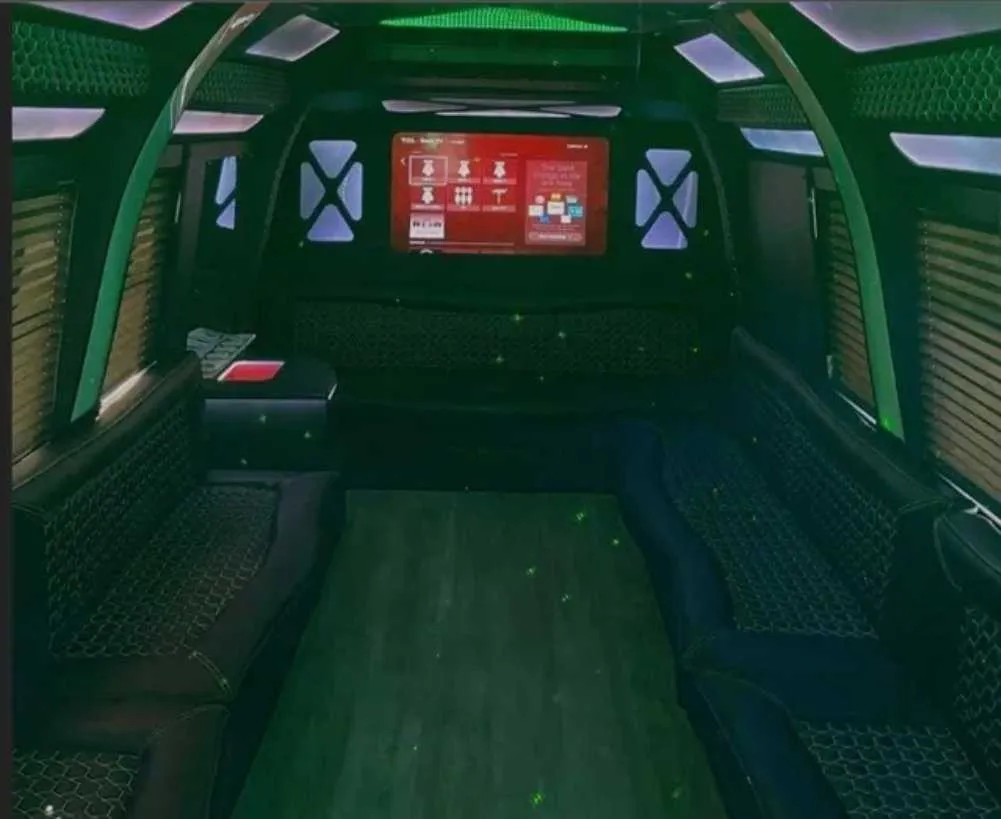 D-Town Bus interior with perimeter lounge seating, window shades and LED accent lighting for party bus rental D-Town Bus interior with perimeter lounge seating, window shades and LED accent lighting for party bus rental