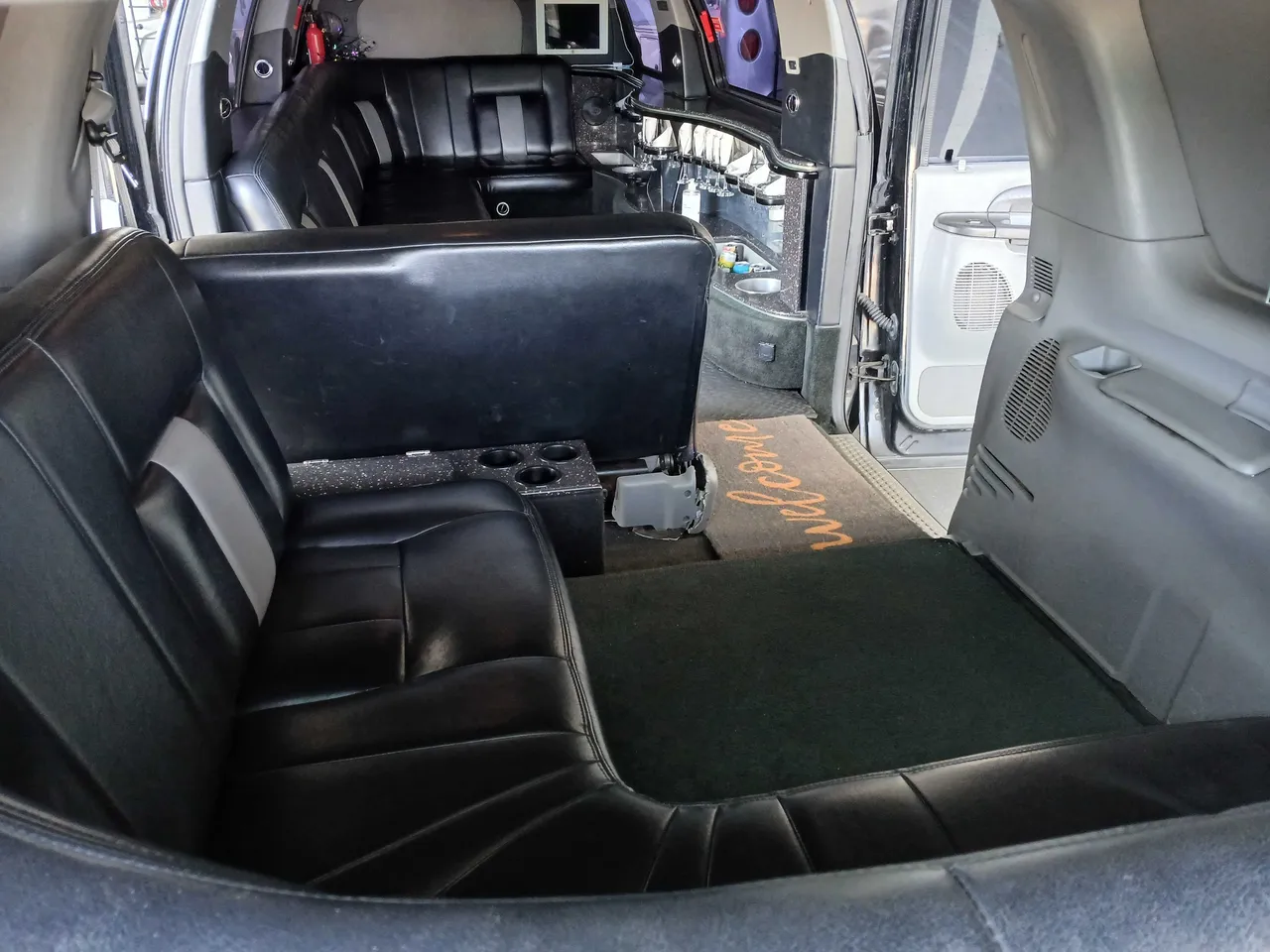 Excursion Limousine interior with cup holders for hummer limo rental in San Diego, CA