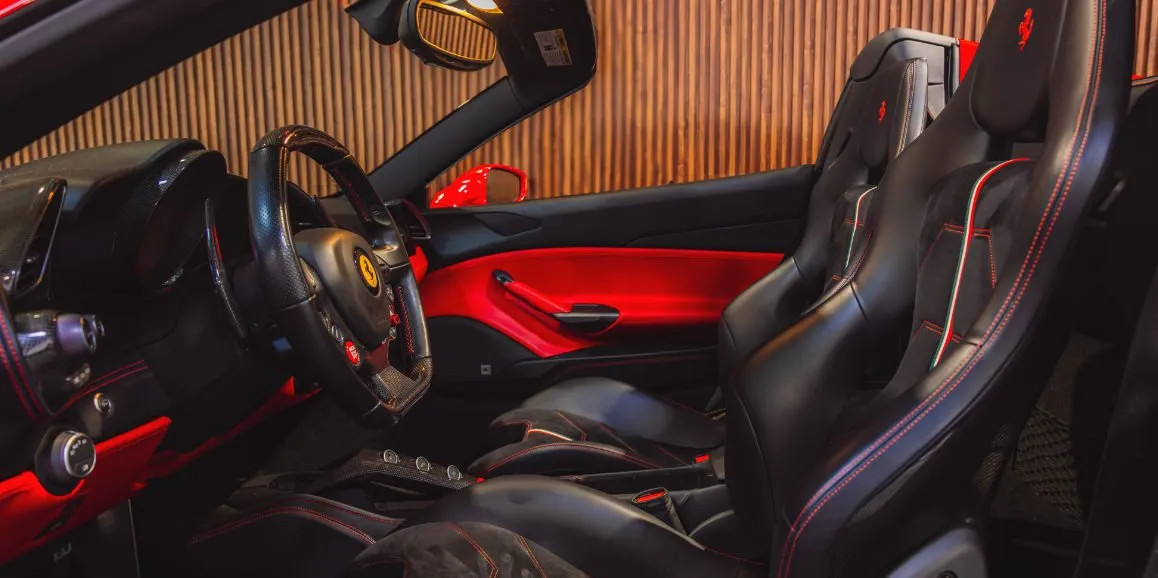 Ferrari 488 Spider interior with convertible roof for wedding car rental in Nassau County, NY Ferrari 488 Spider interior with convertible roof for wedding car rental in Nassau County, NY
