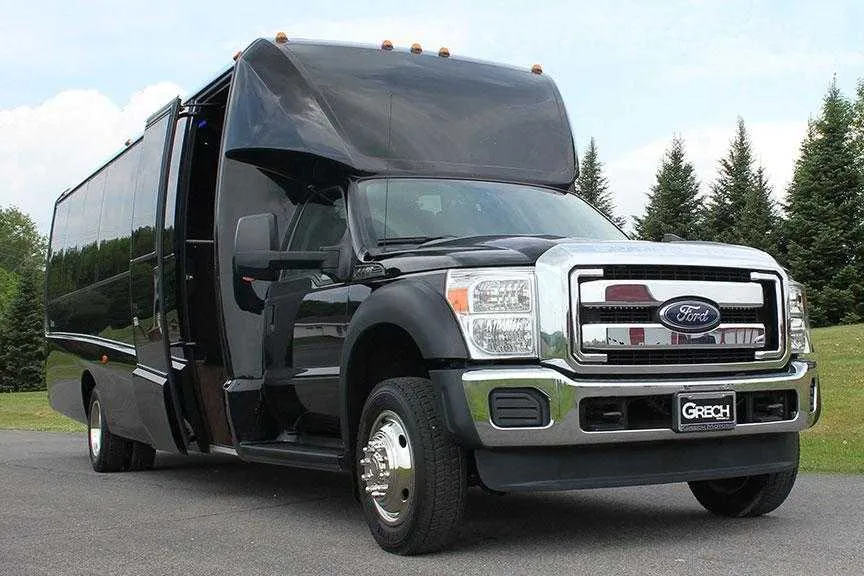Black Ford F550 Party Bus Limo exterior for party bus rental in Palm Coast, FL