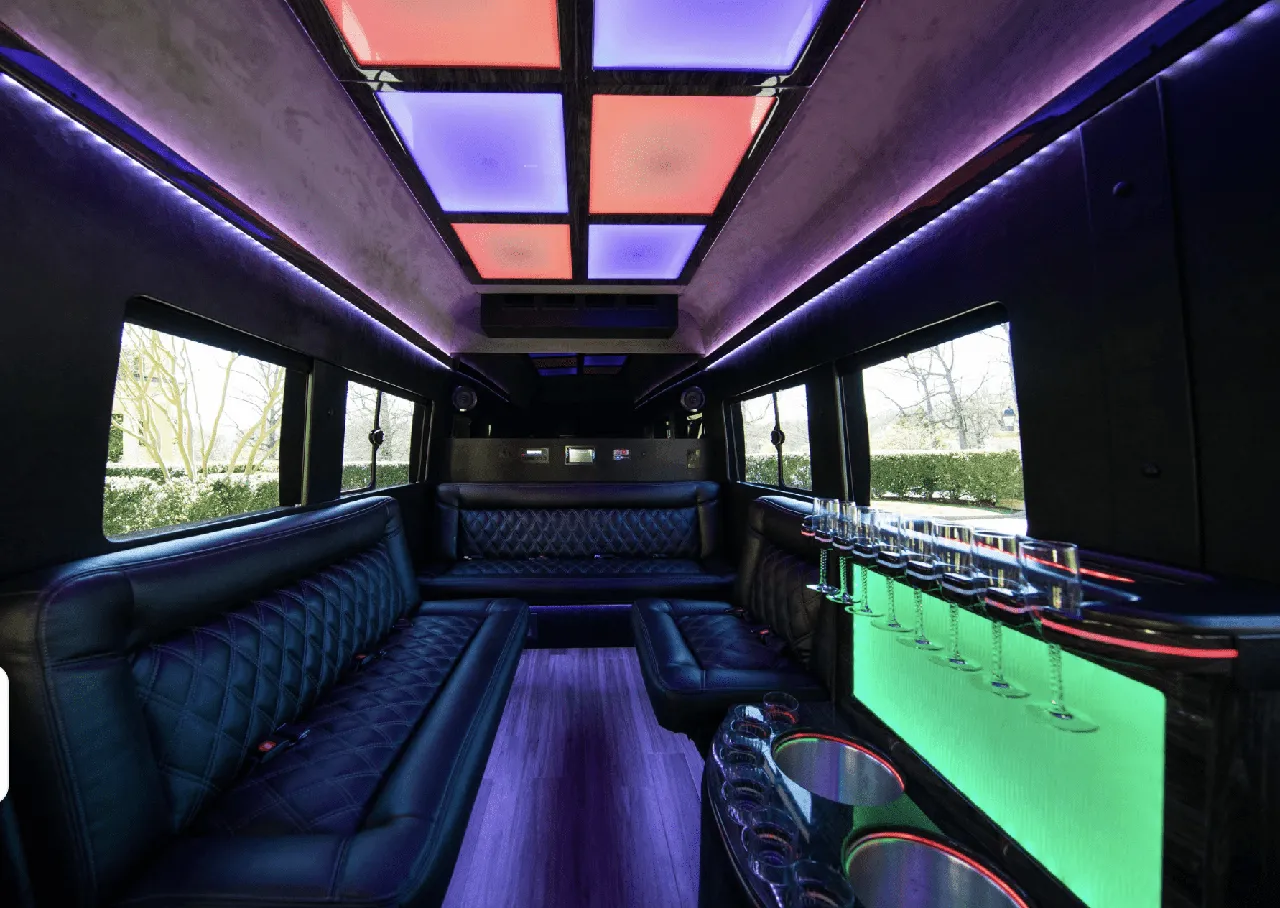Ford Limo Sprinter interior with sofa-style seating, LED accent lighting and LED ceiling lighting for party bus rental