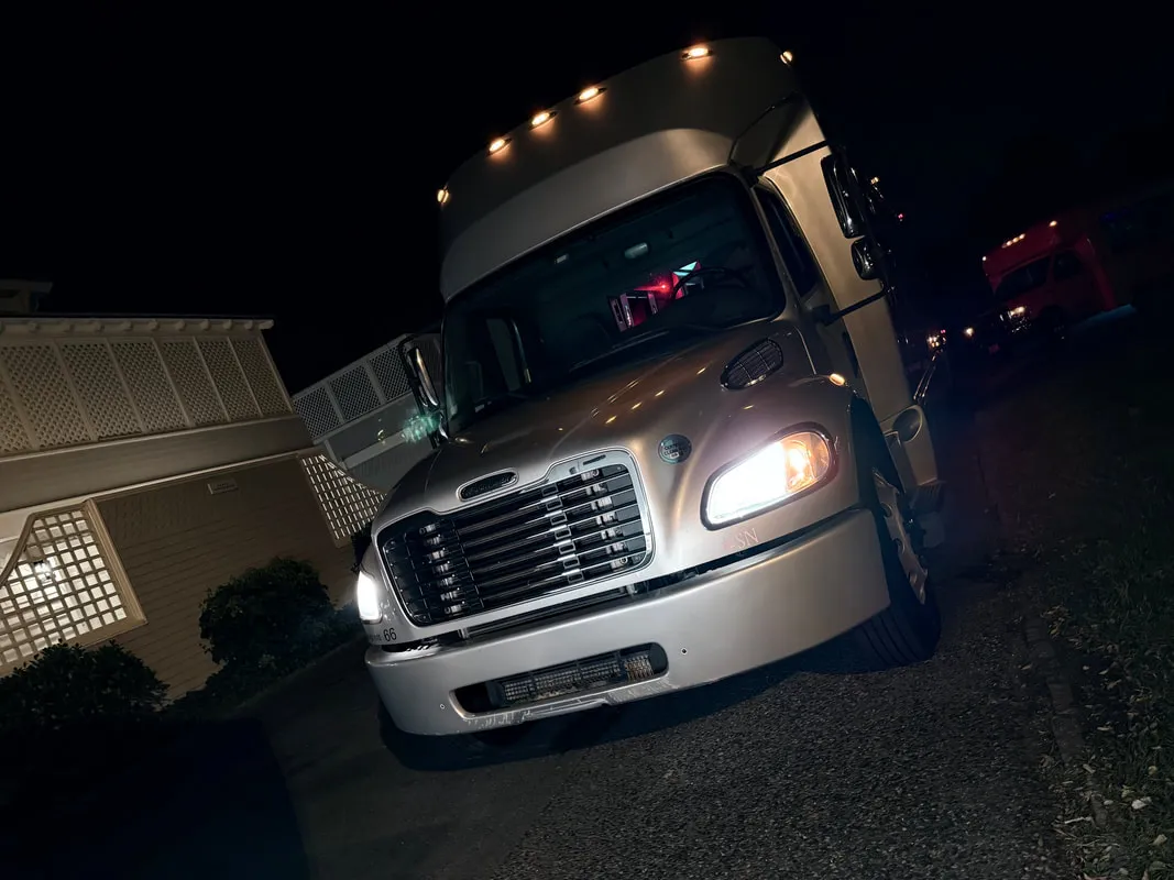 Silver Freightliner Party Bus exterior, photo 3 for party bus rental in North Attleboro, MA