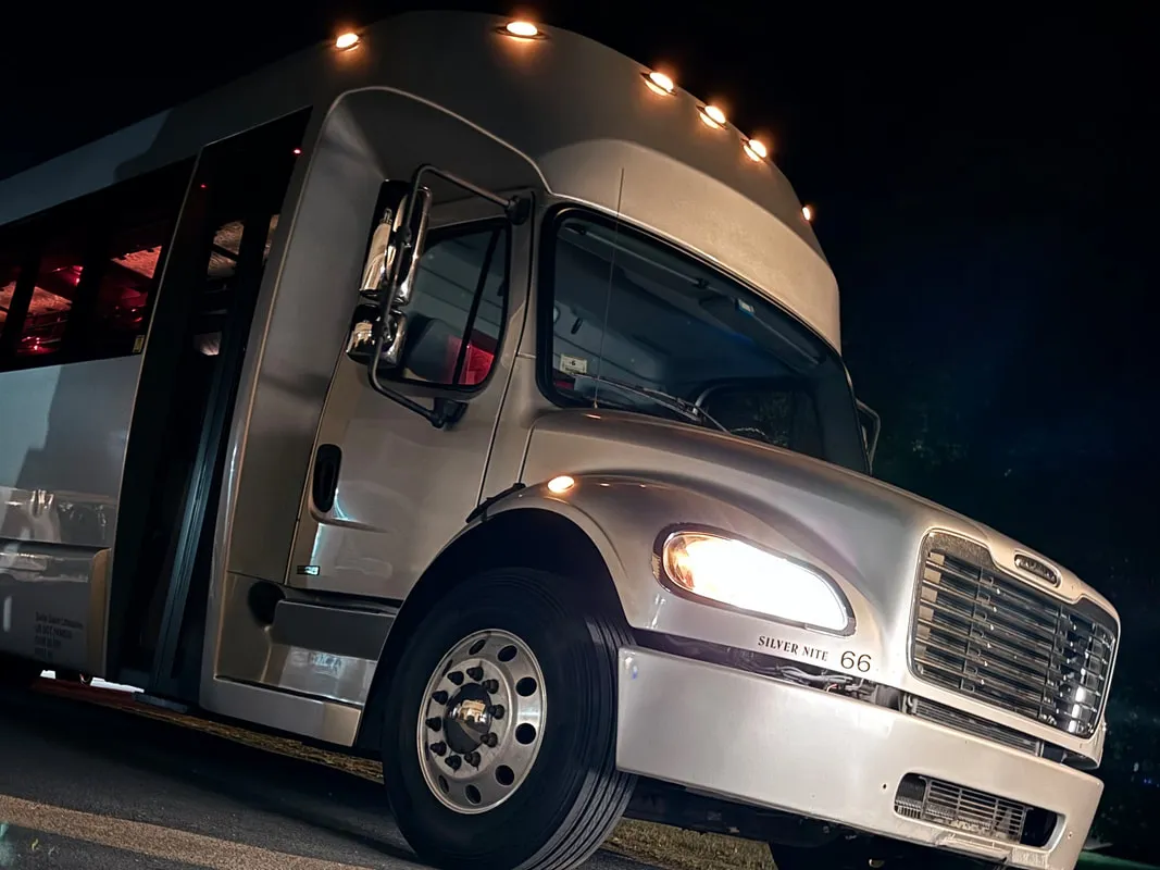 Silver Freightliner Party Bus exterior, photo 4 for party bus rental in North Attleboro, MA