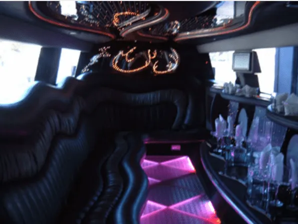 Passenger cabin: Hummer Limousine; lit dance floor and bar area