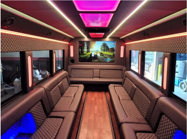 Limousine Bus interior with perimeter lounge seating, LED accent lighting and LED ceiling lighting, photo 2 for prom car rental in Kenner, LA