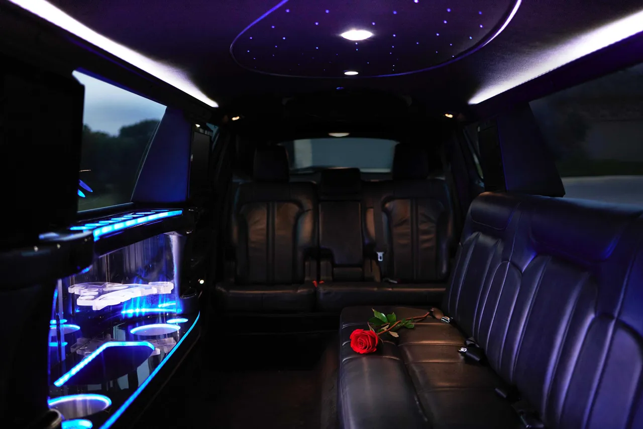 Lincoln MKT Limo interior with LED accent lighting, starlight or fiber-optic ceiling and bar area for limo rental in Keller, TX