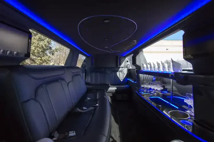 Lincoln MKT Limousine interior with LED accent lighting, starlight or fiber-optic ceiling and bar area for limo rental in Saint Paul, MN