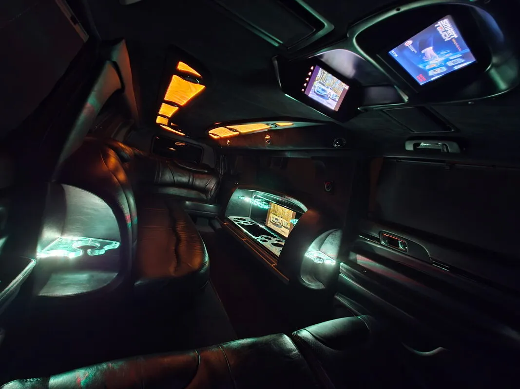 Lincoln MKT Limousine interior with LED accent lighting and TV screens, photo 3 for limo rental in North Attleboro, MA
