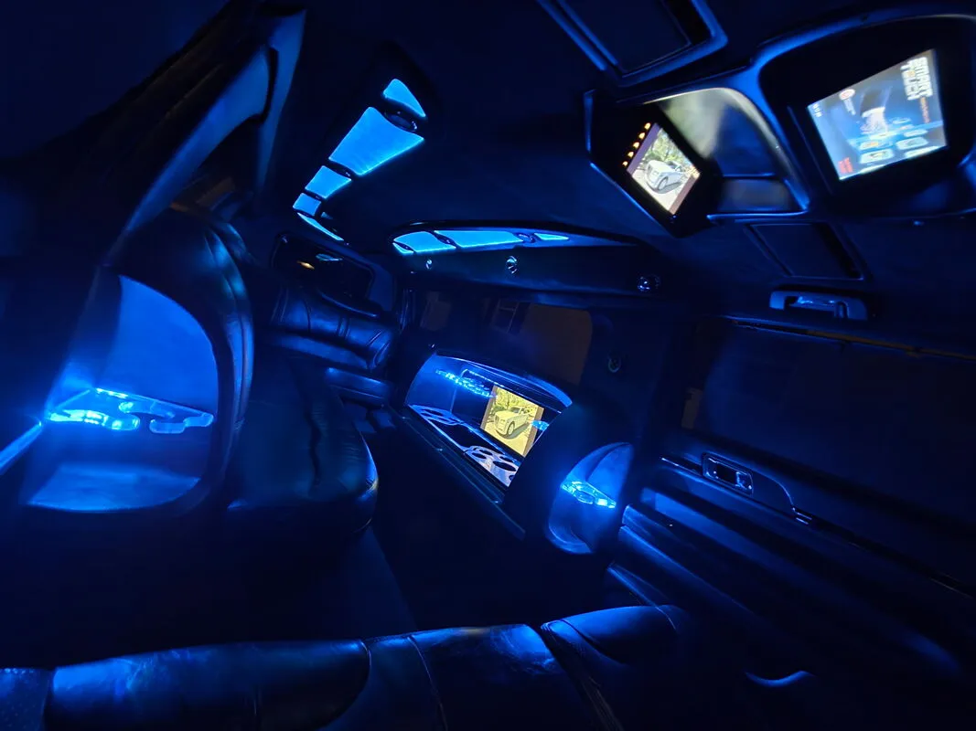 Lincoln MKT Limousine interior with LED accent lighting and TV screens, photo 6 for limo rental in North Attleboro, MA