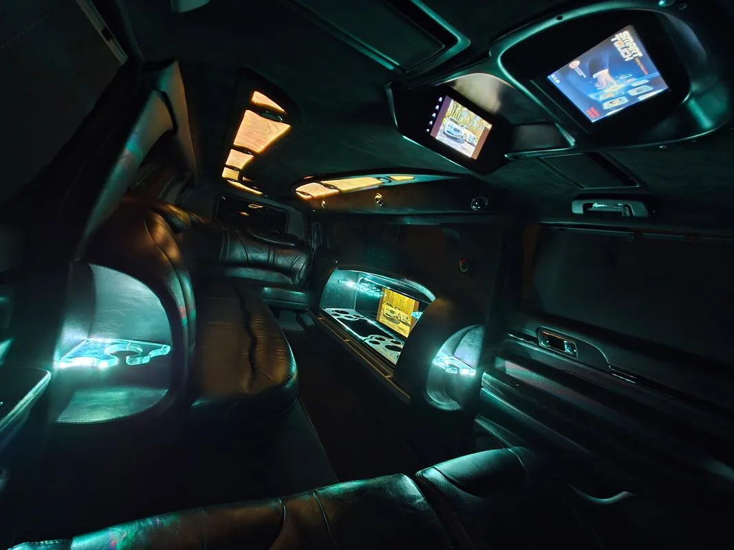 Lincoln MKT Limousine interior with LED accent lighting and TV screens, photo 7 for limo rental in North Attleboro, MA
