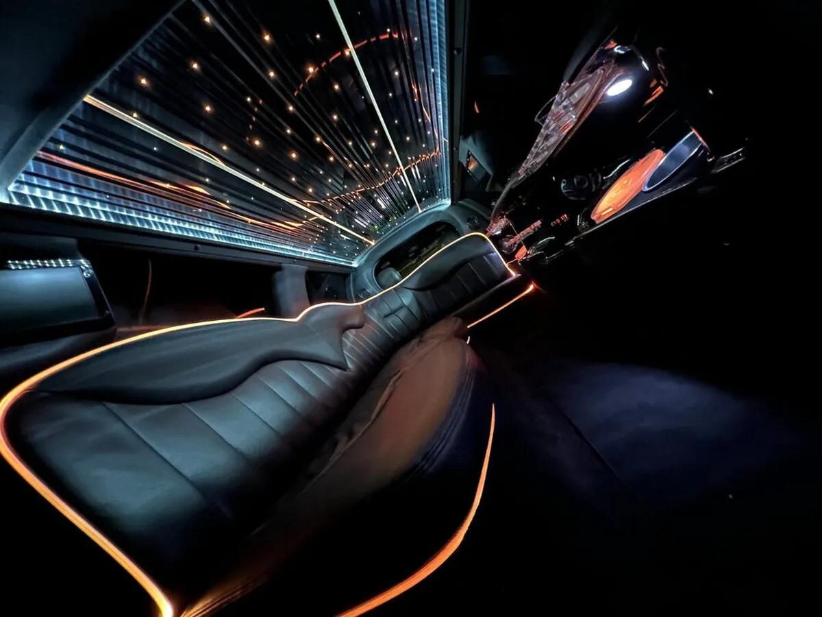Lincoln Town Car Limousine interior with LED accent lighting, LED ceiling lighting and starlight or fiber-optic ceiling, photo 6 for limo rental in North Attleboro, MA