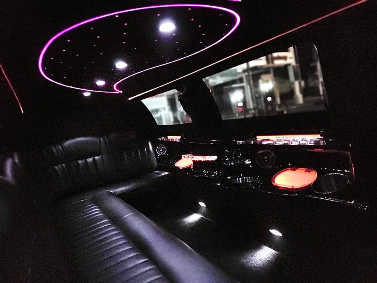 Lincoln Town Car Limousine interior with perimeter lounge seating and starlight or fiber-optic ceiling, photo 8 for limo rental in North Attleboro, MA