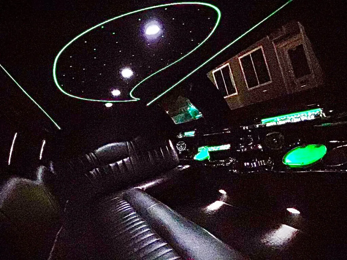 Lincoln Town Car Limousine interior with perimeter lounge seating and starlight or fiber-optic ceiling for limo rental in North Attleboro, MA