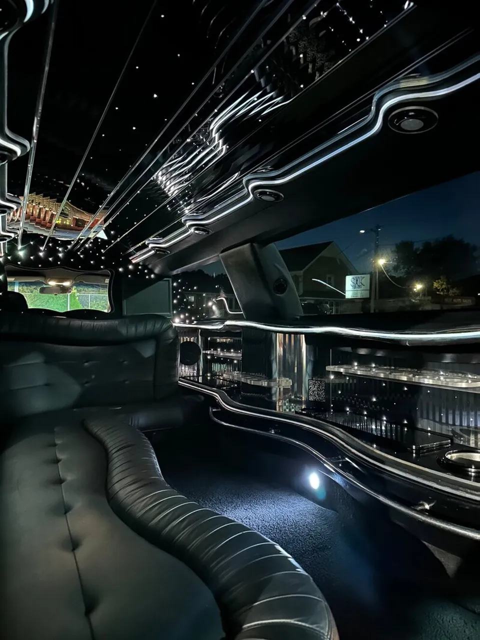 Lincoln Town Car Limousine interior with sofa-style seating, LED accent lighting and starlight or fiber-optic ceiling, photo 12 for limo rental in North Attleboro, MA