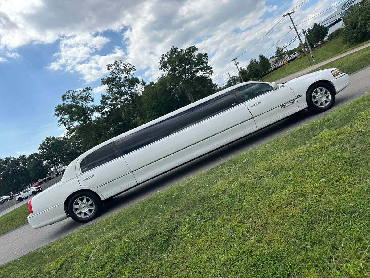 White Lincoln Town Car Limousine with tinted windows for limo rental in North Attleboro, MA