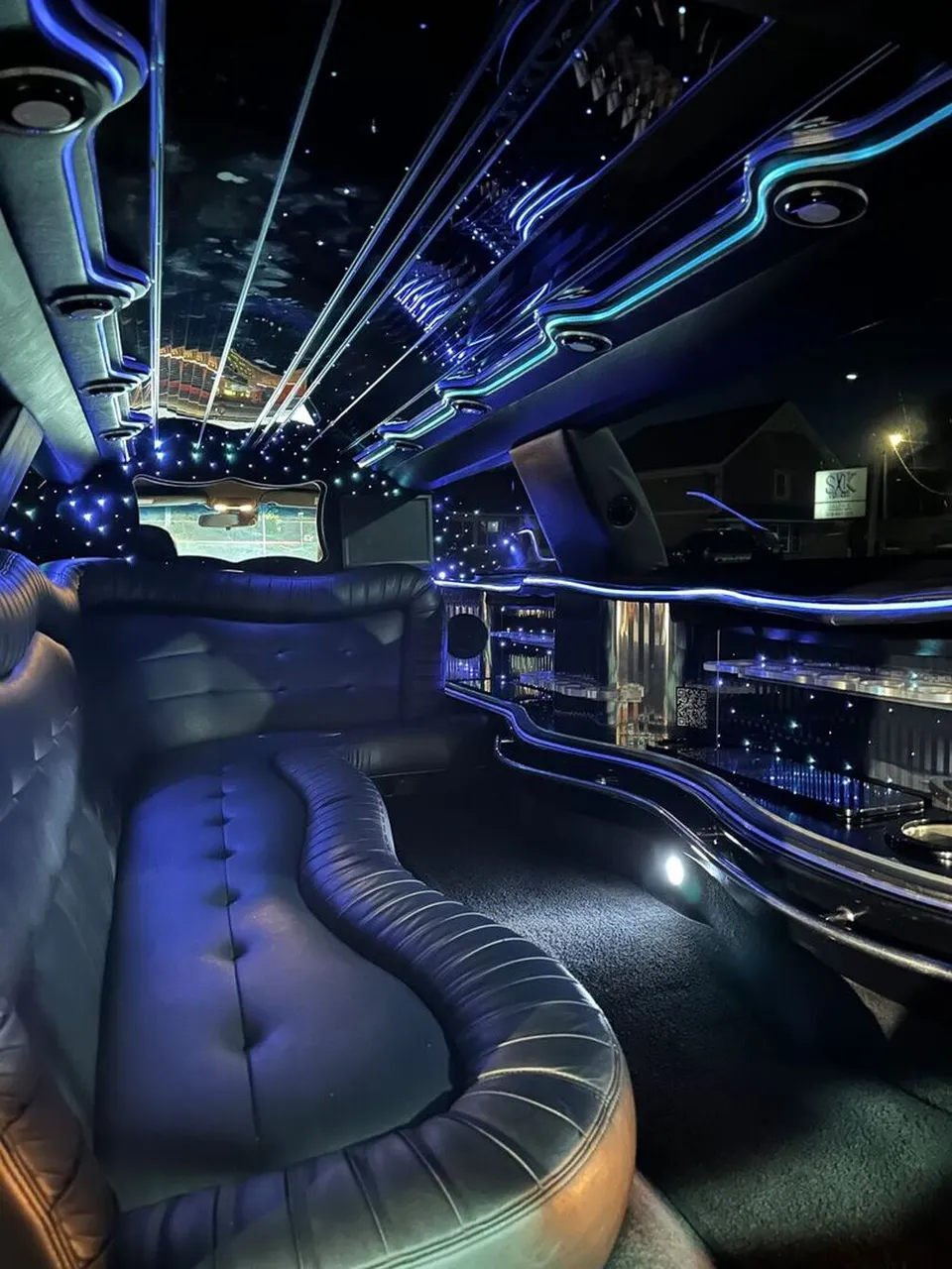 Lincoln Town Car Limousine interior with sofa-style seating, LED accent lighting and starlight or fiber-optic ceiling for limo rental in North Attleboro, MA