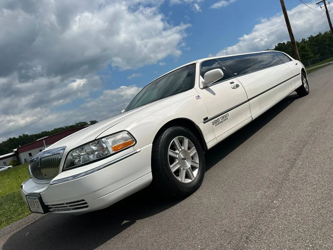 White Lincoln Town Car Limousine exterior with tinted windows for limo rental in North Attleboro, MA