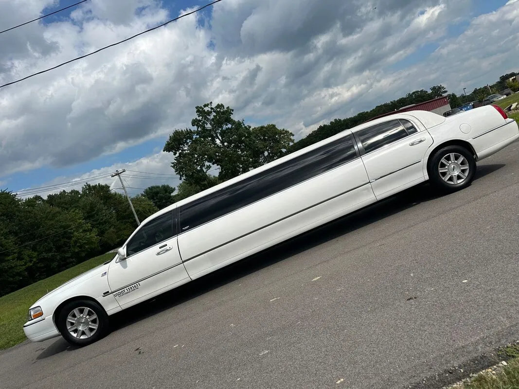 White Lincoln Town Car Limousine exterior with tinted windows, photo 4 for limo rental in North Attleboro, MA