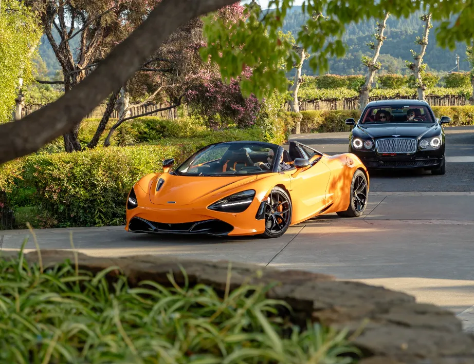 Orange McLaren 720S Performance Spider exterior with convertible roof for wedding car rental in Napa, CA