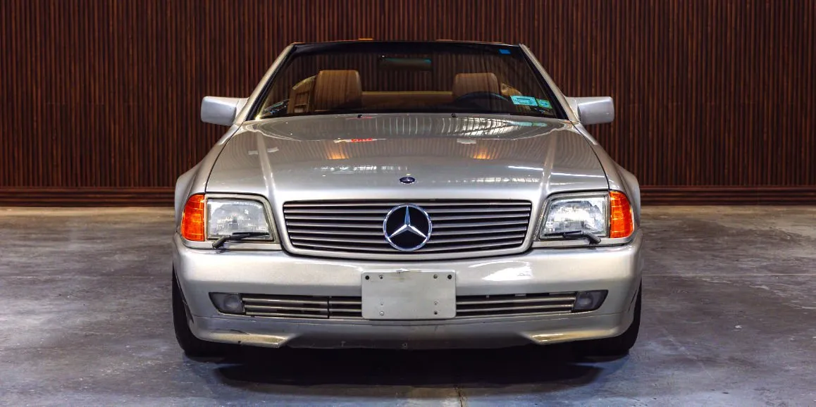 Silver Mercedes-Benz SL500 exterior with convertible roof for wedding car rental in Hempstead, NY