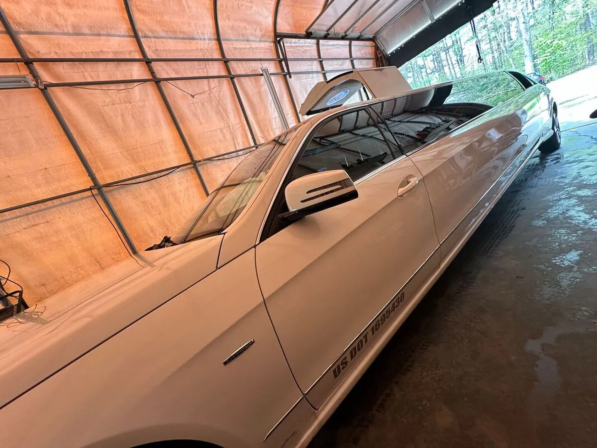 White Mercedes-Benz Jet Doors Limousine exterior with tinted windows for limo rental in North Attleboro, MA