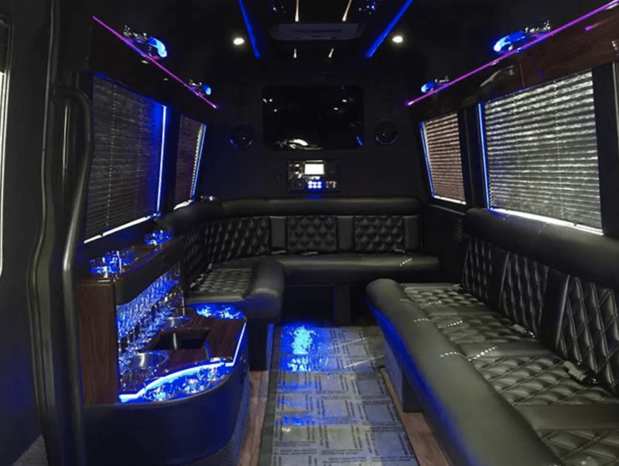 Mercedes-Benz Limousine Sprinter interior with perimeter lounge seating, window shades and LED accent lighting for party bus rental in Golden, CO