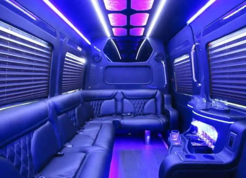 Mercedes-Benz Limousine Sprinter interior with perimeter lounge seating, window shades and LED accent lighting for prom car rental in Davis, CA