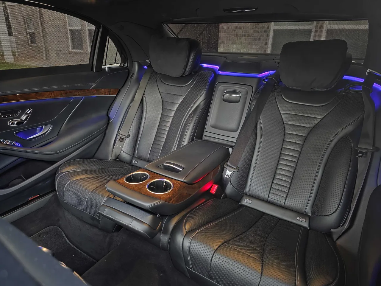 Mercedes-Benz S550 'Duchess' interior with cup holders and LED accent lighting for wedding car rental