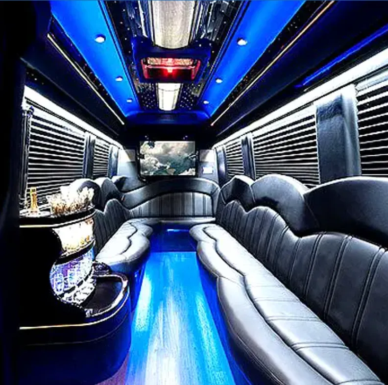 Mercedes-Benz Sprinter Limousine interior with perimeter lounge seating, sofa-style seating and window shades for prom car rental in Burbank, CA