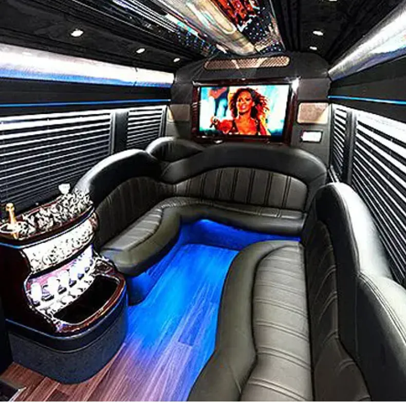 Mercedes-Benz Sprinter Limousine interior with perimeter lounge seating, window shades and LED accent lighting for prom car rental in Burbank, CA