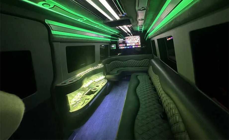 Mercedes-Benz Sprinter Limousine interior with perimeter lounge seating, LED accent lighting and bar area, photo 4 for limo rental in Burson, CA