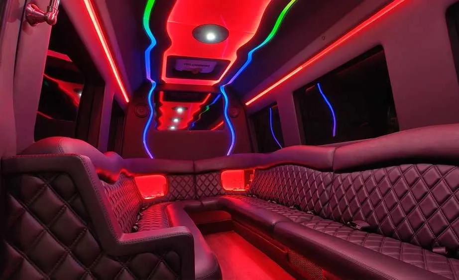 Mercedes-Benz Sprinter Limousine interior with perimeter lounge seating and LED accent lighting, photo 5 for limo rental in Burson, CA