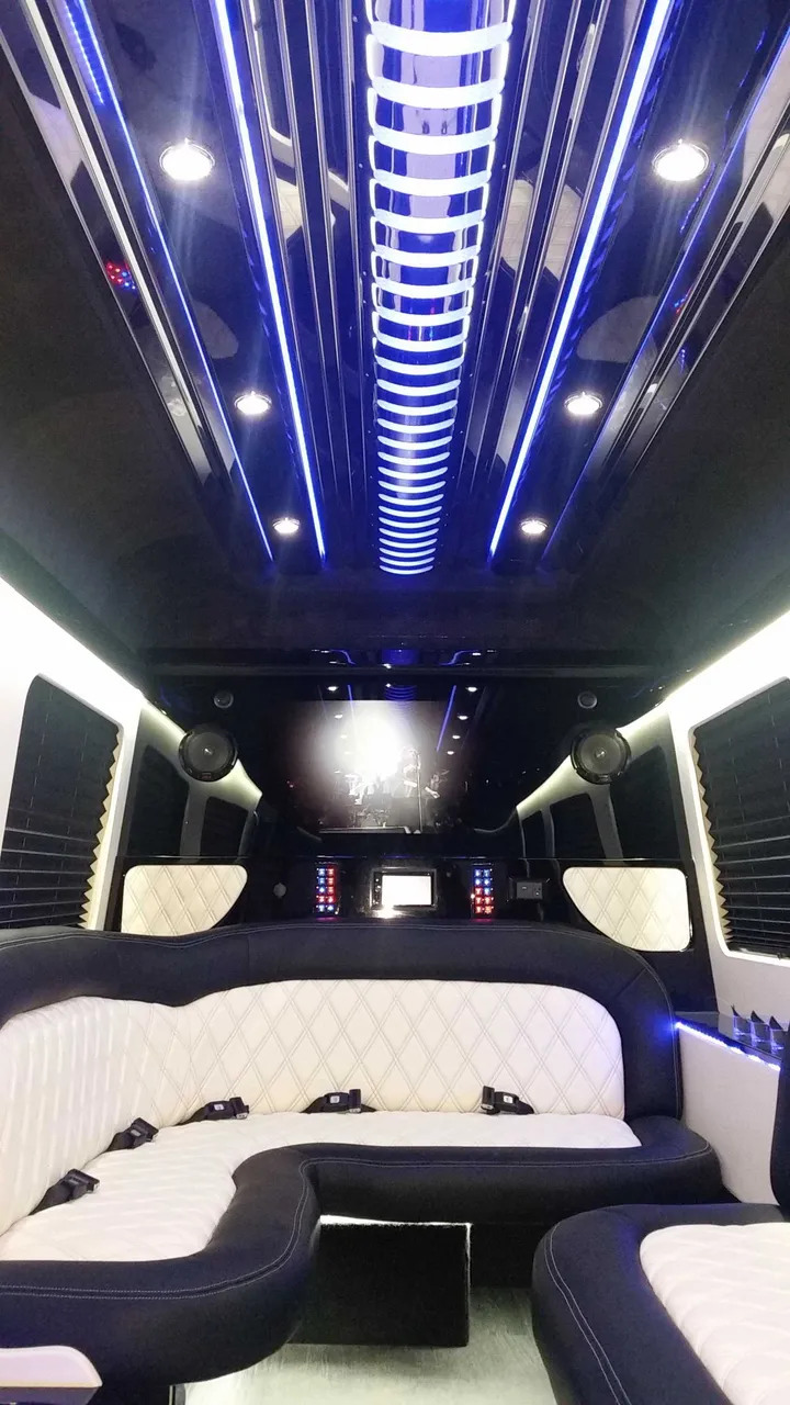 Mercedes-Benz Sprinter Limousine interior with perimeter lounge seating, sofa-style seating and window shades, photo 3 for party bus rental in Plainville, MA