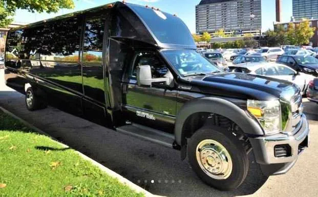 Mini Coach Limousine Bus Black Mini Coach Limousine Bus; tinted windows