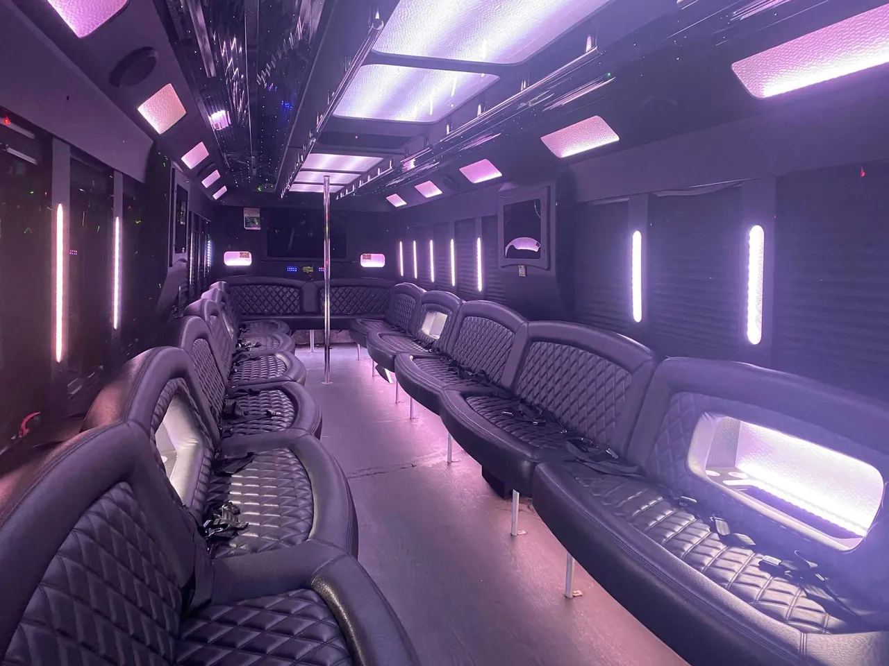 25 Passenger Party Bus 25 Passenger Party Bus interior with perimeter lounge seating, LED accent lighting and LED ceiling lighting for party bus rental