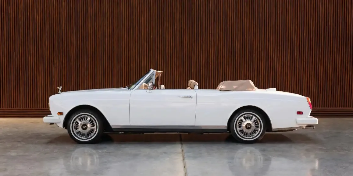 White Rolls-Royce Corniche 1975 exterior with convertible roof for limo rental in Toms River, NJ