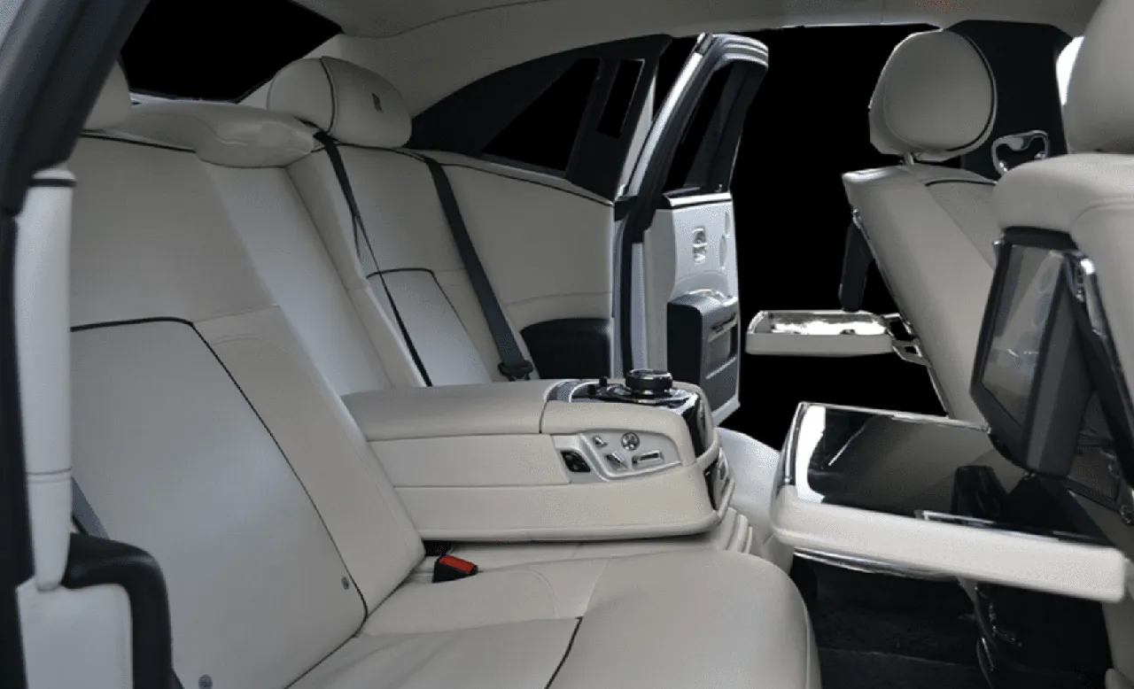 Rolls-Royce Ghost interior with rear-seat entertainment screens for limo rental in Rockville, MD