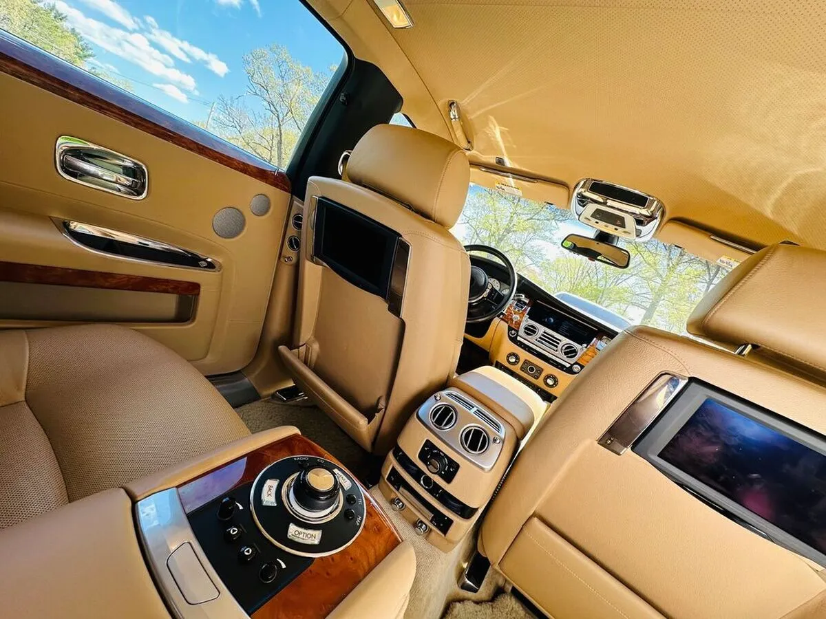 Rolls-Royce Ghost Sedan interior with rear-seat entertainment screens for limo rental in North Attleboro, MA